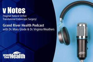 Headphones with microphone on a blue background with the headline ‘vNOTES,’ representing a healthcare podcast about vNOTES.